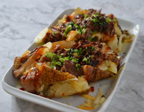 Green chile brisket stuffed potatoes.