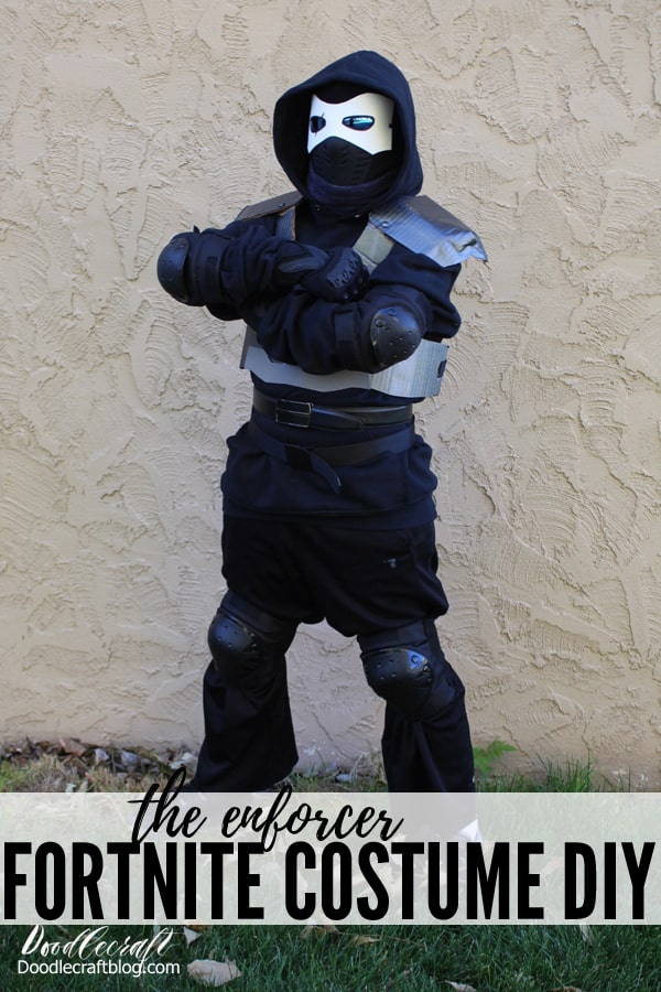 Make the perfect Halloween Fortnite Cosplay. The Enforcer Skin Costume DIY is easy to make with items found in the closet, upcycled items like cardboard, foam and brads and a boogie bomb.