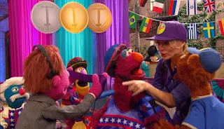 Telly wins the Pogo Gold medal. Baby bear and Gina congratulate him. Sesame Street Episode 4421, The Pogo Games, Season 44.