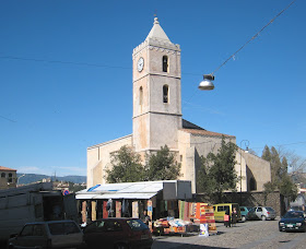A church and market in Oliena