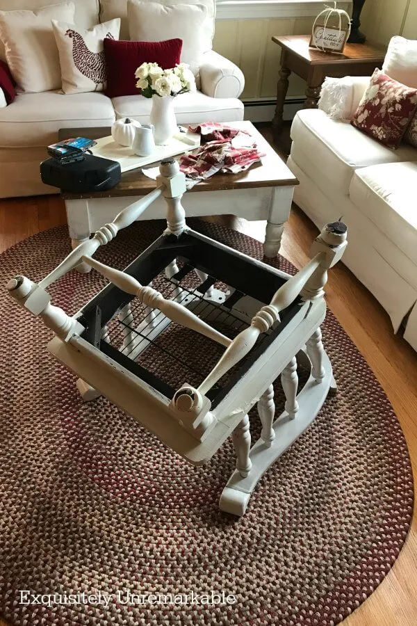 Wooden chair turned upside down in a living room