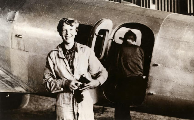 American aviator/pilot Amelia Earhart (1897-1937) standing by a plane dressed in overalls, by Nationaal Archief on Flickr Image: American aviator/pilot Amelia Earhart (1897-1937) standing by a plane dressed in overalls, by Nationaal Archief on Flickr
