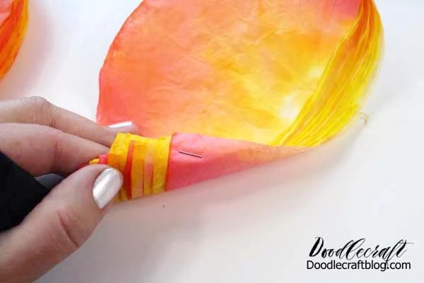 How to make a rose out of coffee filters dyed with food coloring.
