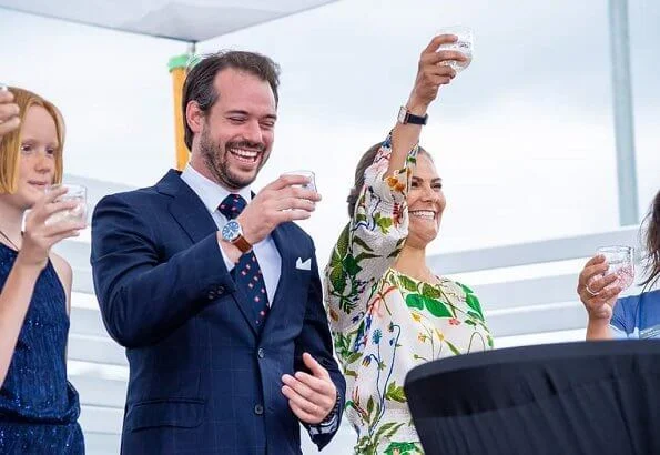 Crown Princess Victoria wore Rodebjer irmaline floral print top and skirt. Caroline Svedbom gold earrings. Prince Felix of Luxembourg