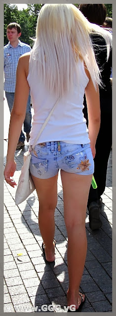 Girl in blue mini shorts on the street