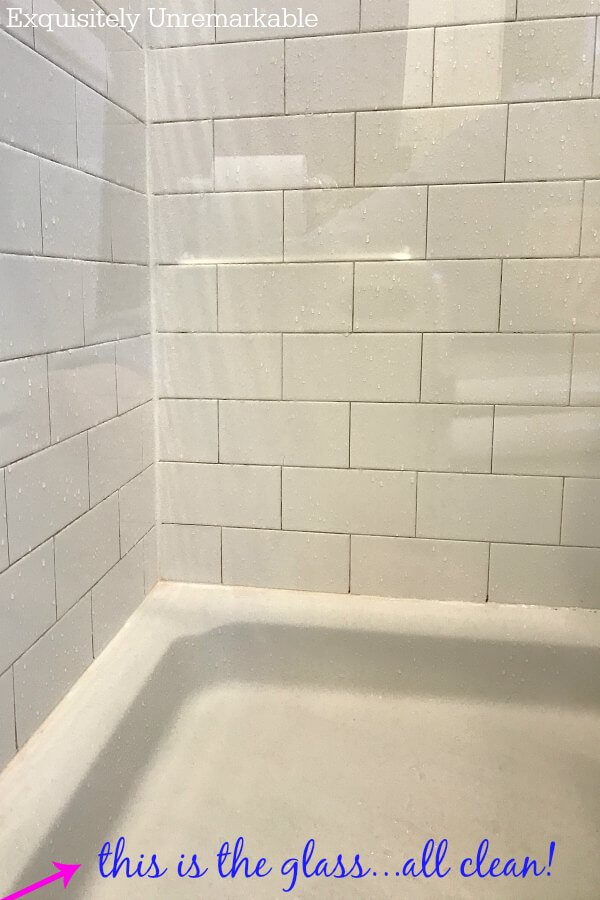 Crystal Clear Shower Doors White tiled shower with clean glass doors
