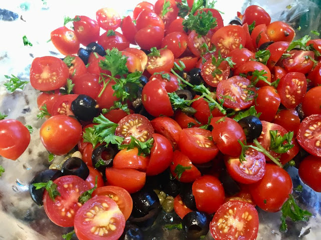 Mixture of tomato, olive, parsley, and caper sauce tomato and caper sauce