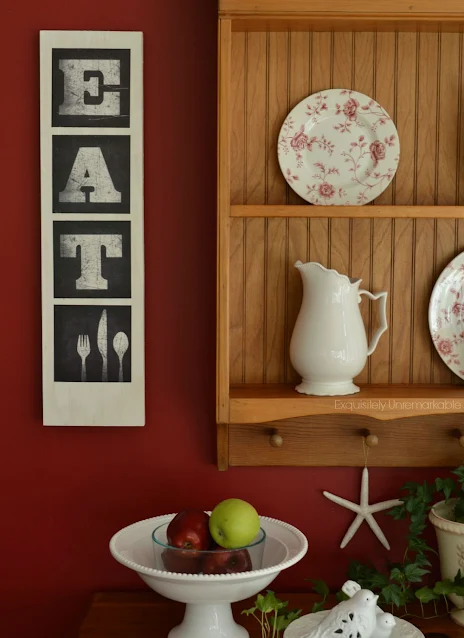 Eat Kitchen Sign hanging on wayy