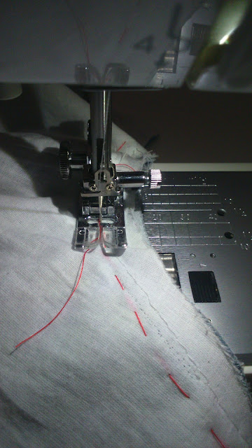 Setting in sleeves - seam is machine sewn with the garment facing, using the feed dogs to help ease the sleeve in. 