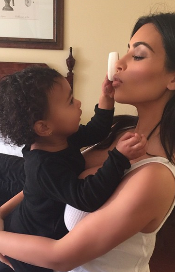 3 North West helps Kim K with her makeup...