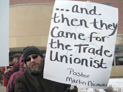 Man with sign reading Then they came for the trade unionists