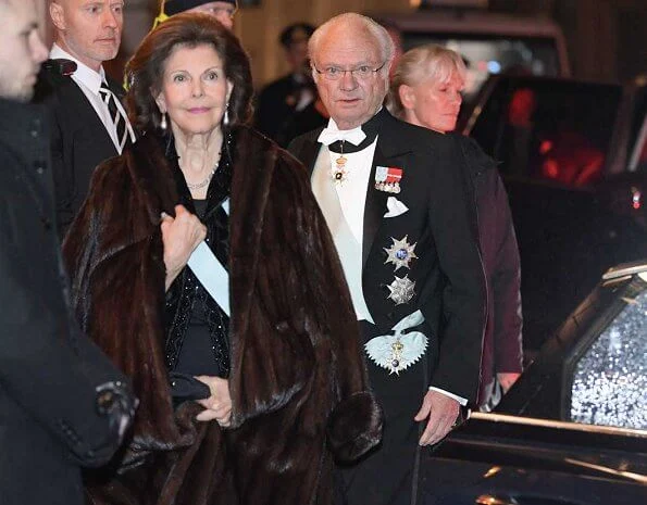 Queen Silvia and Prince Daniel. Crown Princess Victoria wore Filippa K faux fur jacket. burgundy. red velvet dress. Princess Madeleine