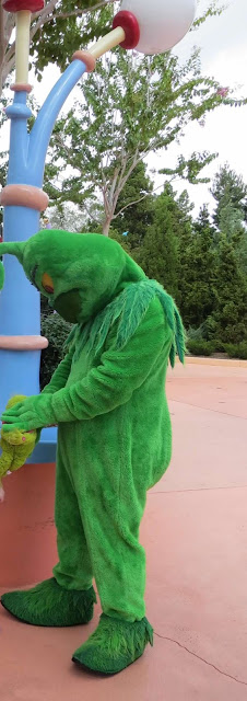 The Grinch Holding a Grinch Plush Islands of Adventure Universal The Grinch Holding a Grinch Plush Islands of Adventure Universal