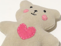 http://sewtoy.com/free-toy-sewing-pattern/how-to-sew-quickly-a-lovable-little-soft-baby-teddy-bear/