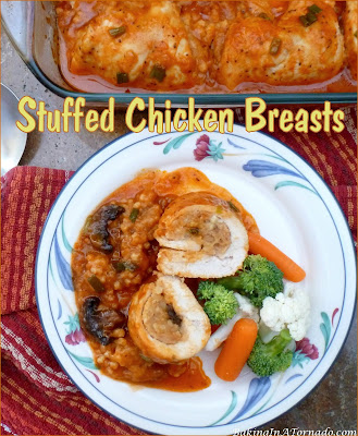 Stuffed Chicken Breasts, thin chicken breasts are stuffed with a cracker stuffing and baked in a tangy sauce. Ten minutes prep time and one hour in the oven. | Recipe developed by www.BakingInATornado.com | #dinner #chicken