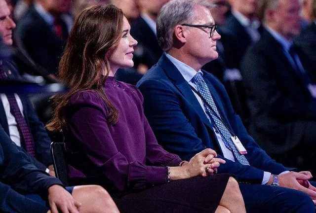 Crown Princess Mary wore a burgundy, purple silk top and burgundy purple wool midi skirt