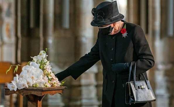 Queen Elizabeth wore a black mask and Jardine diamond star brooch.  National Service of Remembrance at The Cenotaph
