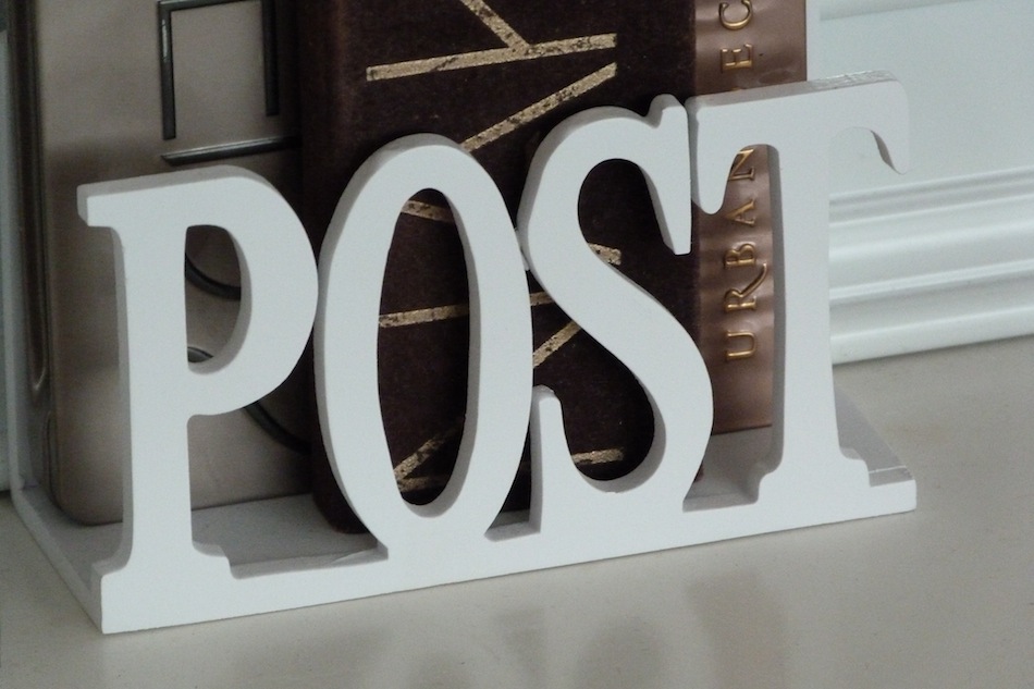 an image of a white wooden post rack