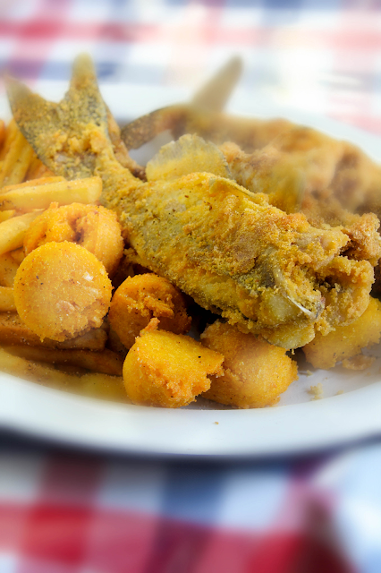Southern Fried Whole Catfish, a delicious authentic Southern dish.  The catfish is well coated with seasoned cornmeal and flour mixture, then deep fried in hot oil until crispy, crunchy delicious.  