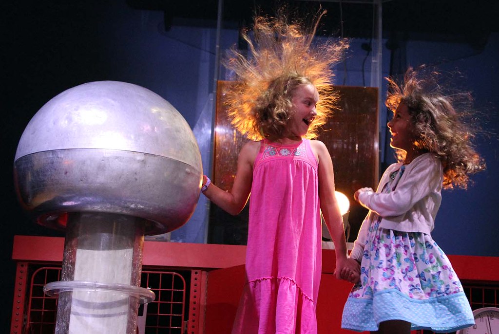 Excited about Van de Graaff generator when we touch it VAN DE GRAAFF