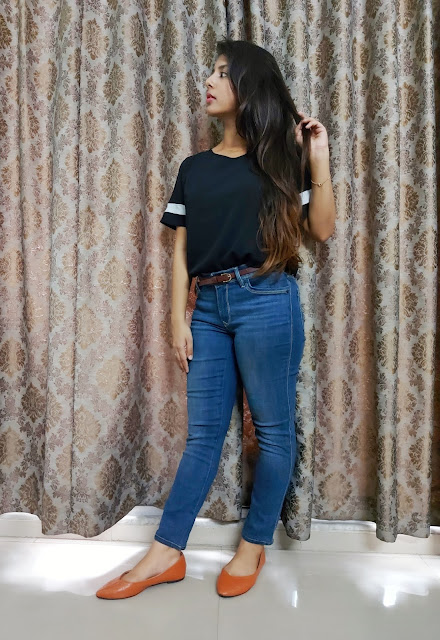 Ritu Biswas styling black top and blue denim in her fashion and lifestyle blog. Ritu Biswas styling black top and blue denim in her fashion and lifestyle blog.