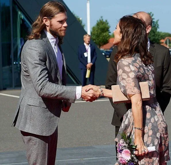 Crown Princess Mary wore Gianvito Rossi Gianvito Patent Leather Pumps and she carried Hugo Boss suede clutch bag. Handball player Mikkel Hansen