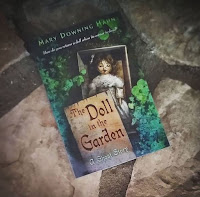 book review the doll in the garden