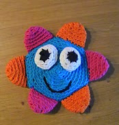 http://www.ravelry.com/patterns/library/crinkle-flower-baby-toy