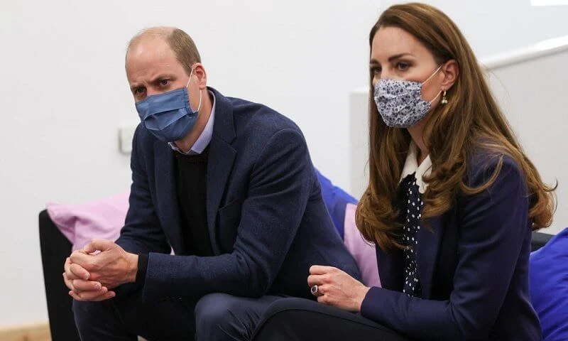 Kate Middleton wore a new polka dot blouse from Tory Burch, and high waisted trousers from Jigsaw. Freya Rose gold hoops with pearls