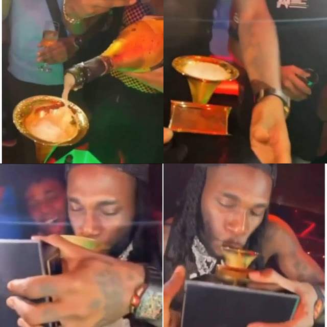Watch the Moment Burna Boy uses his Grammy plaque to drink Champagne in a Club (video)