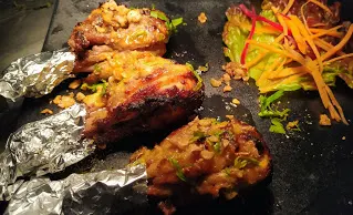 Tangdi kebab pieces on a serving plate