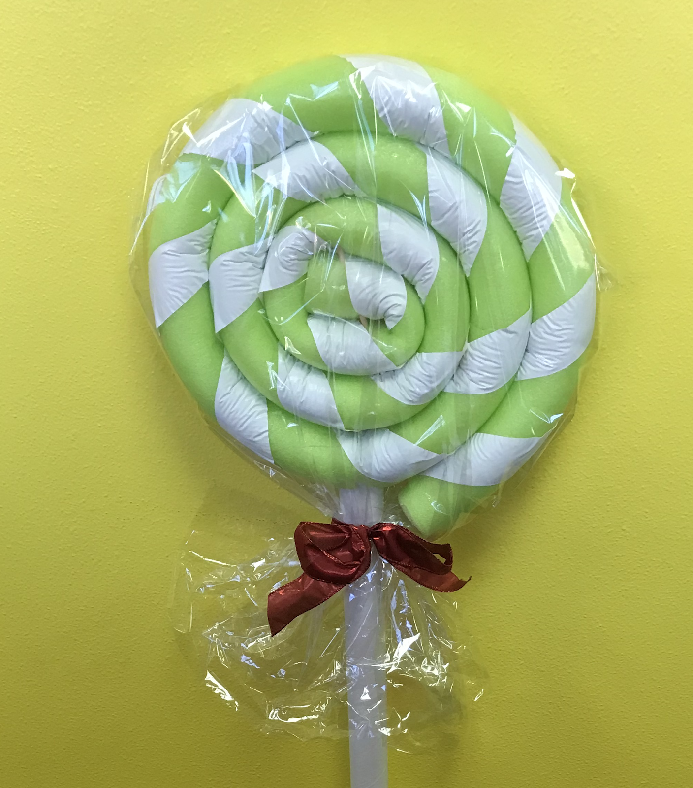 DIY Giant Lollipop Decorations Made from Pool Noodles and Tape (Candy