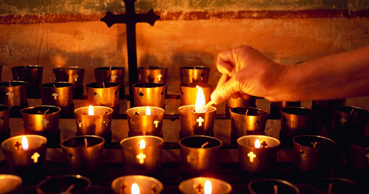Why do Catholics light candles