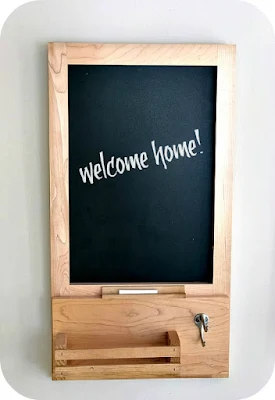 Chalkboard message center made from a repurposed kitchen cabinet display