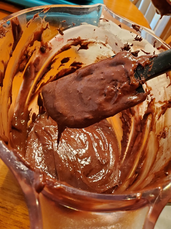 this is batter for half moon cookies using a chocolate cake mix showing how thick it is
