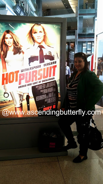Lifestyle Editor Tracy Iglesias of Ascending Butterfly in front of Hot Pursuit Movie Poster