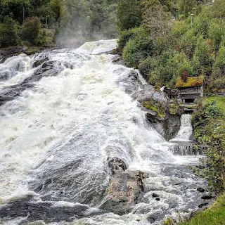 Mill at Hellesylt waterfall on Geirangerfjord in Norway