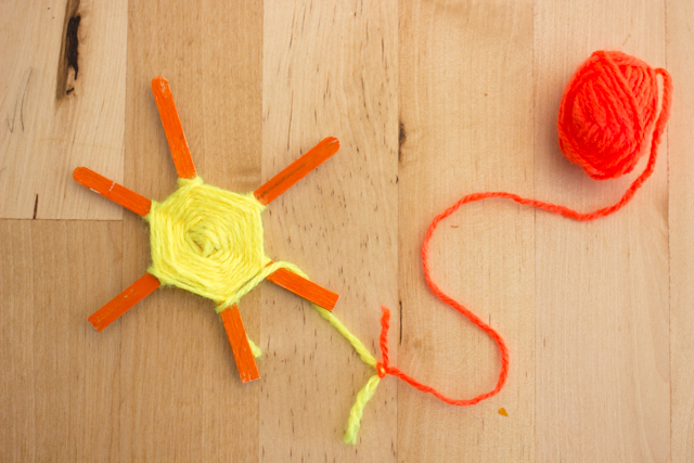 smiley sun popsicle stick weaving- great Summer kids craft!