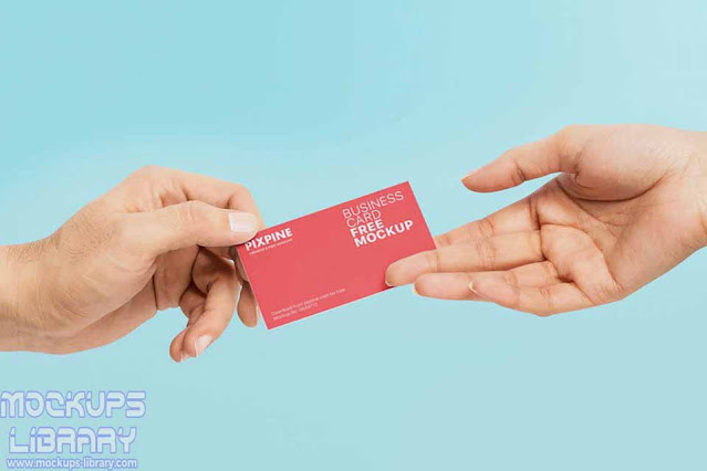 hands holding business card mockup
