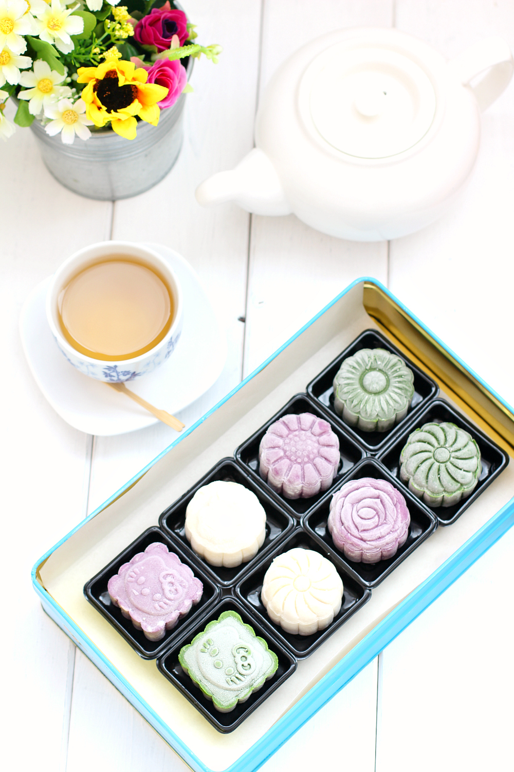 Snowskin mooncakes with purple sweet potato and cream cheese filling