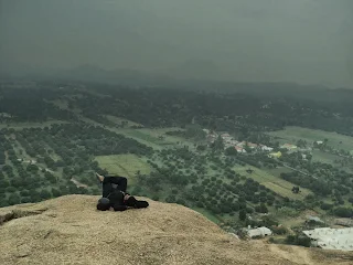 Hiker gets his morning sleep atop the RS trek with fog shouding the hillock and the hiker as well