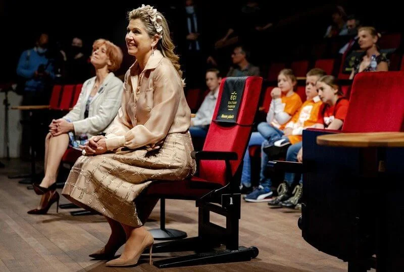 Queen Maxima wore a beige silk blouse, hirt and beige embellished skirt from Natan, and Fabienne Delvigne hairpiece