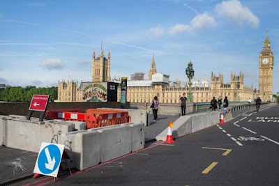 Barrier between pedestrians and cars is installed on Westminster Bridge two months after a driver ploughed into pedestrians