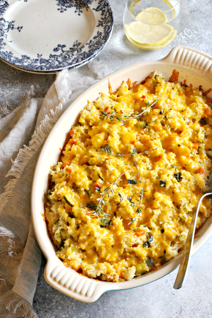 Cheesy-Rice-and-Vegetable-Bake-1 Recipe for a cheese topped rice casserole cooked with onions, carrots, zucchini and butternut squash.