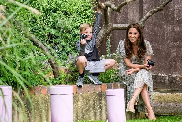 Kate Middleton is wearing a print floral summery midi dress, Castaner wedges and her Catherine Zoraida earrings