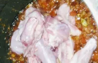 Adding chicken pieces with the masala spices for chicken curry recipe