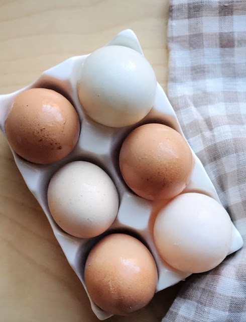 tray of brown and white eggs