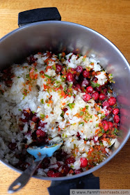 image of a pot containing the ingredients needed to make cranberry salsa
