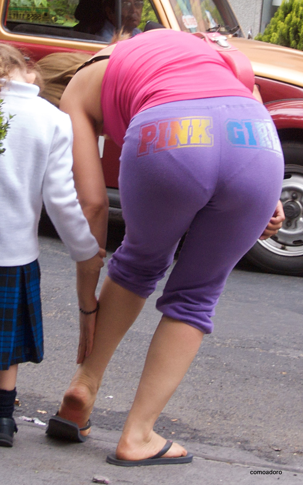 Mature women walking on the street, visible panties line in tight yoga pant...