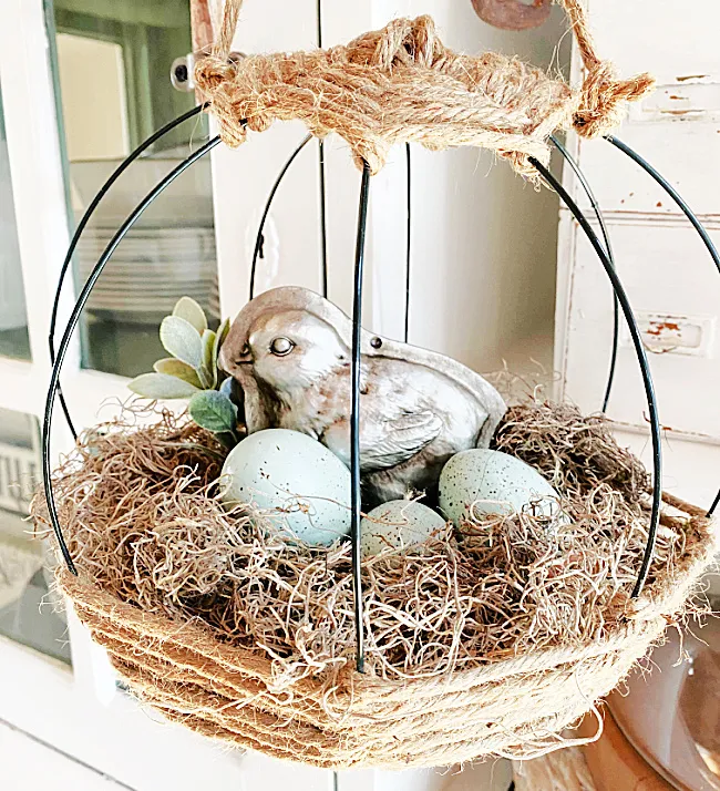 jute basket with eggs and silver chick